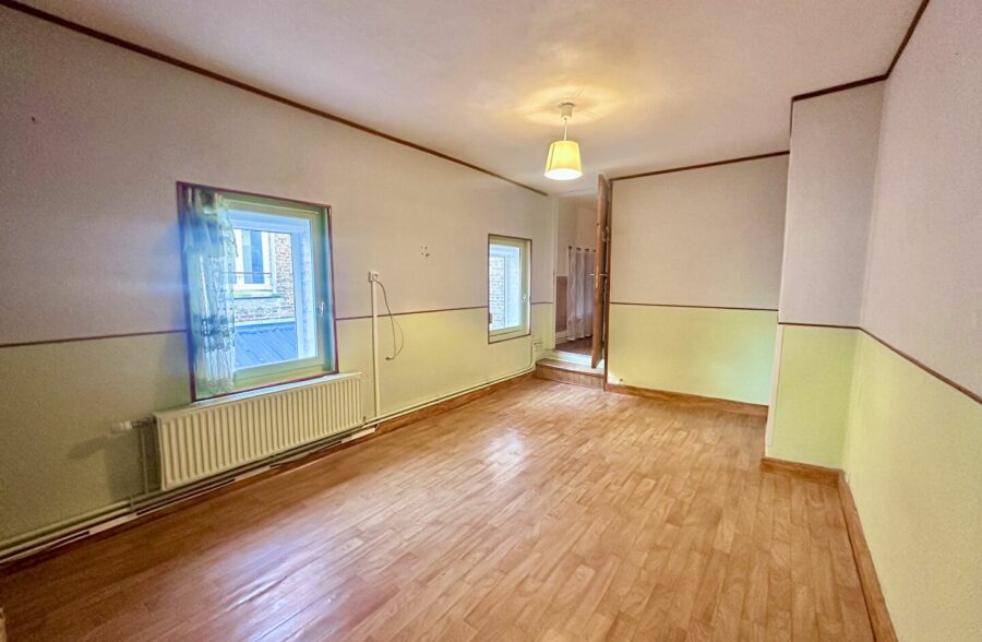 Immeuble avec commerce, habitation et jardin en coeur de ville.